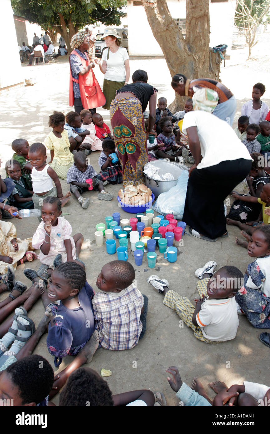 Food aid being distributed to children at  the Liteta Leper Invalid Compound in Lusaka Zambia Stock Photo