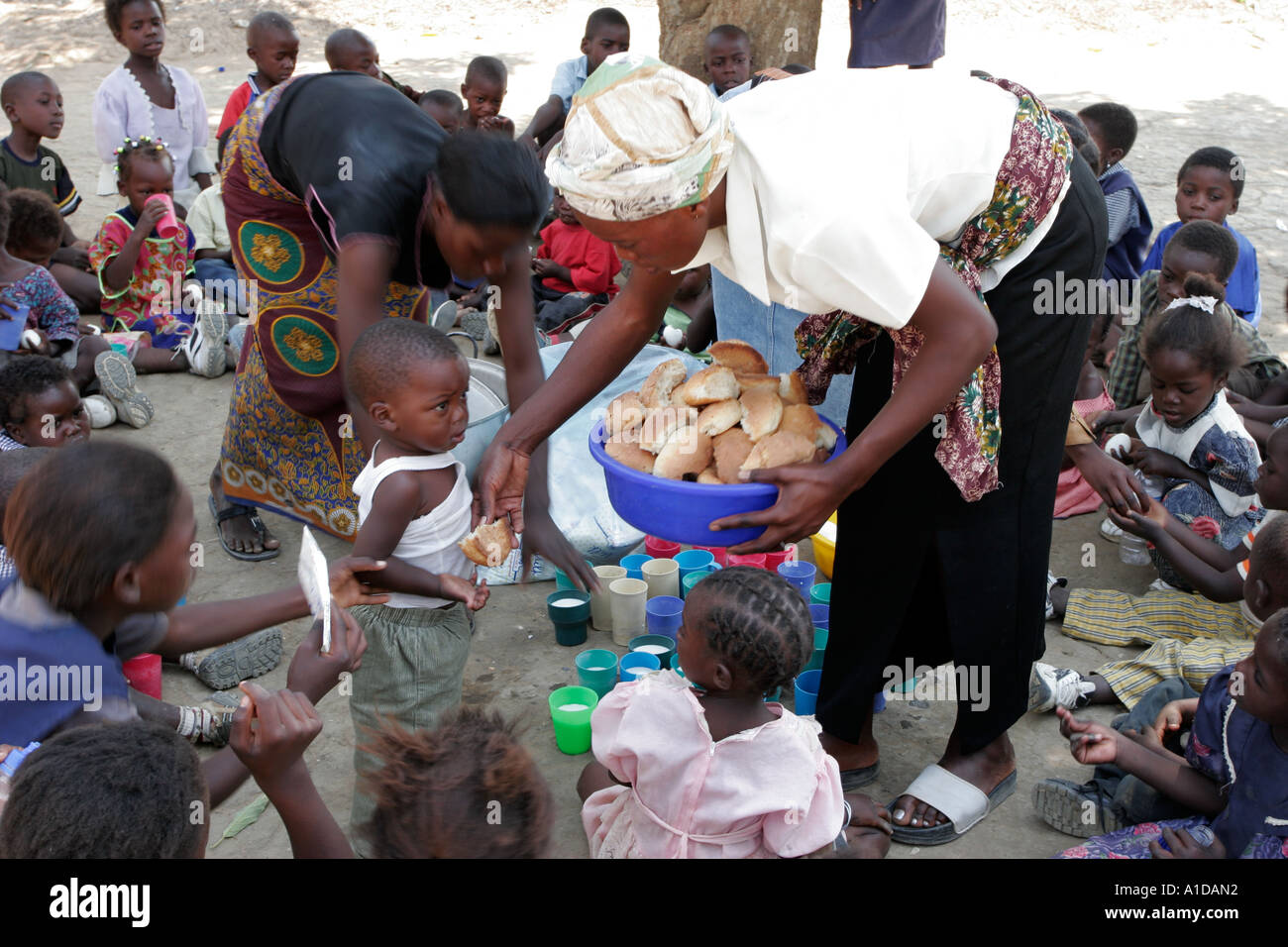 Food aid being distributed to children at  the Liteta Leper Invalid Compound in Lusaka Zambia Stock Photo