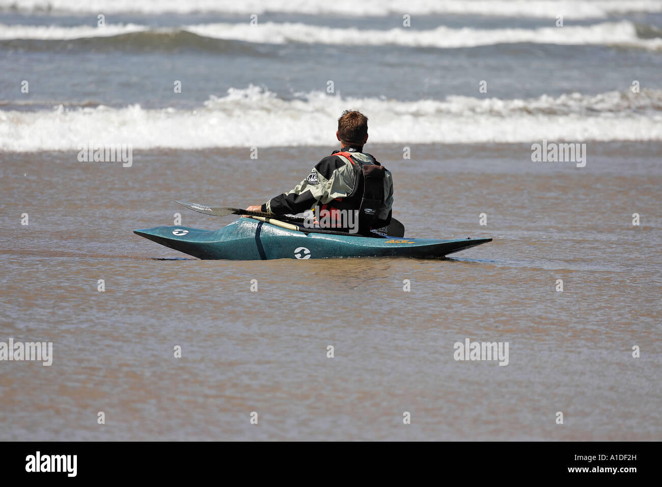 Kayak waits for the next wave at Inch Beach, Kerry, Dingle peninsula, Ireland Stock Photo