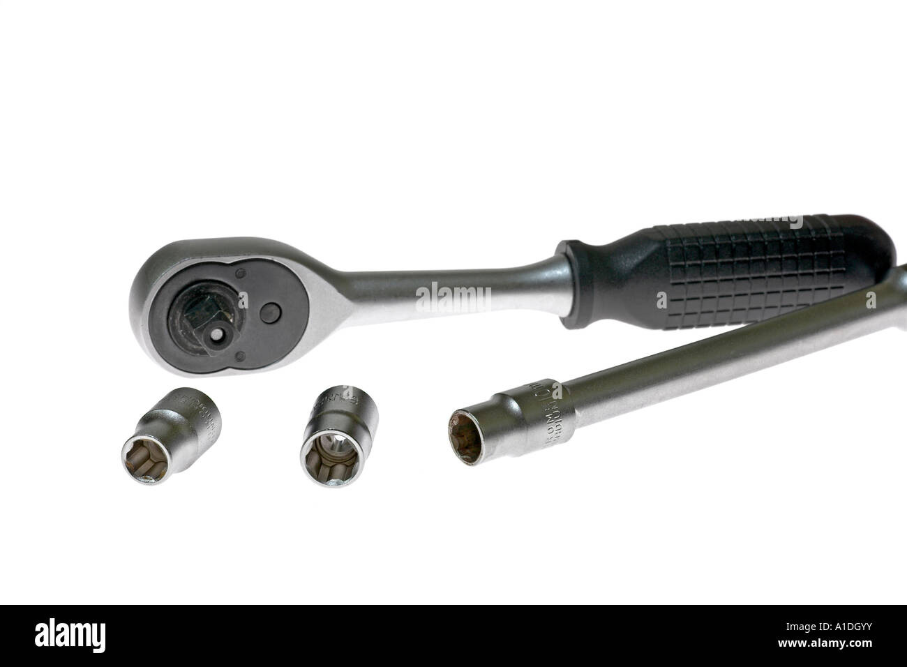 Tool, sockets and ratchet wrench made of chrome vanadium steel on white