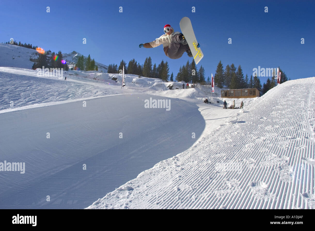 Snowboarder On Half Pipe Jumping Through Air Pulling Of A Grab Stock Photo Alamy Snowboarder On Half Pipe Jumping Through Air Pulling Of A Grab Stock Photo Alamy