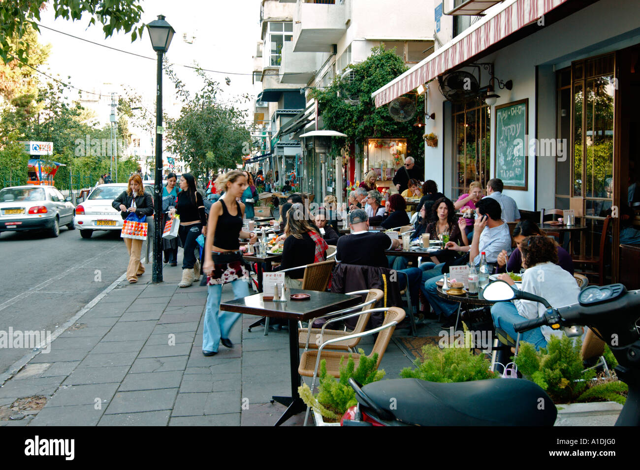 Israel Tel Aviv Drinking Coffee and relaxing in an open air cafe in Shenkin Street November 2005 Stock Photo