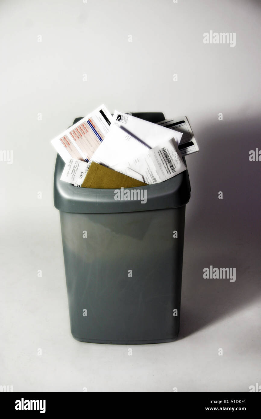 Waste paper bin with receipts bills and other identity related