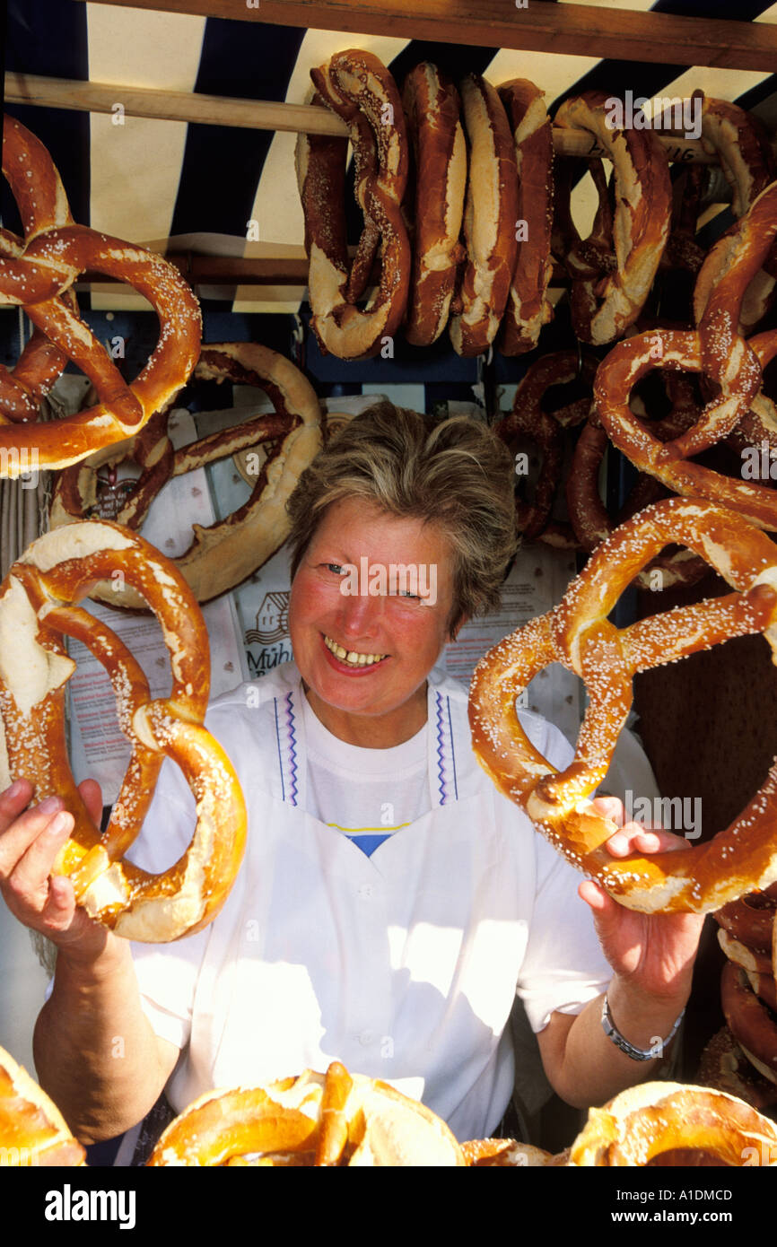Germany, Munich, Oktoberfest, Woman with pretzels Stock Photo Alamy