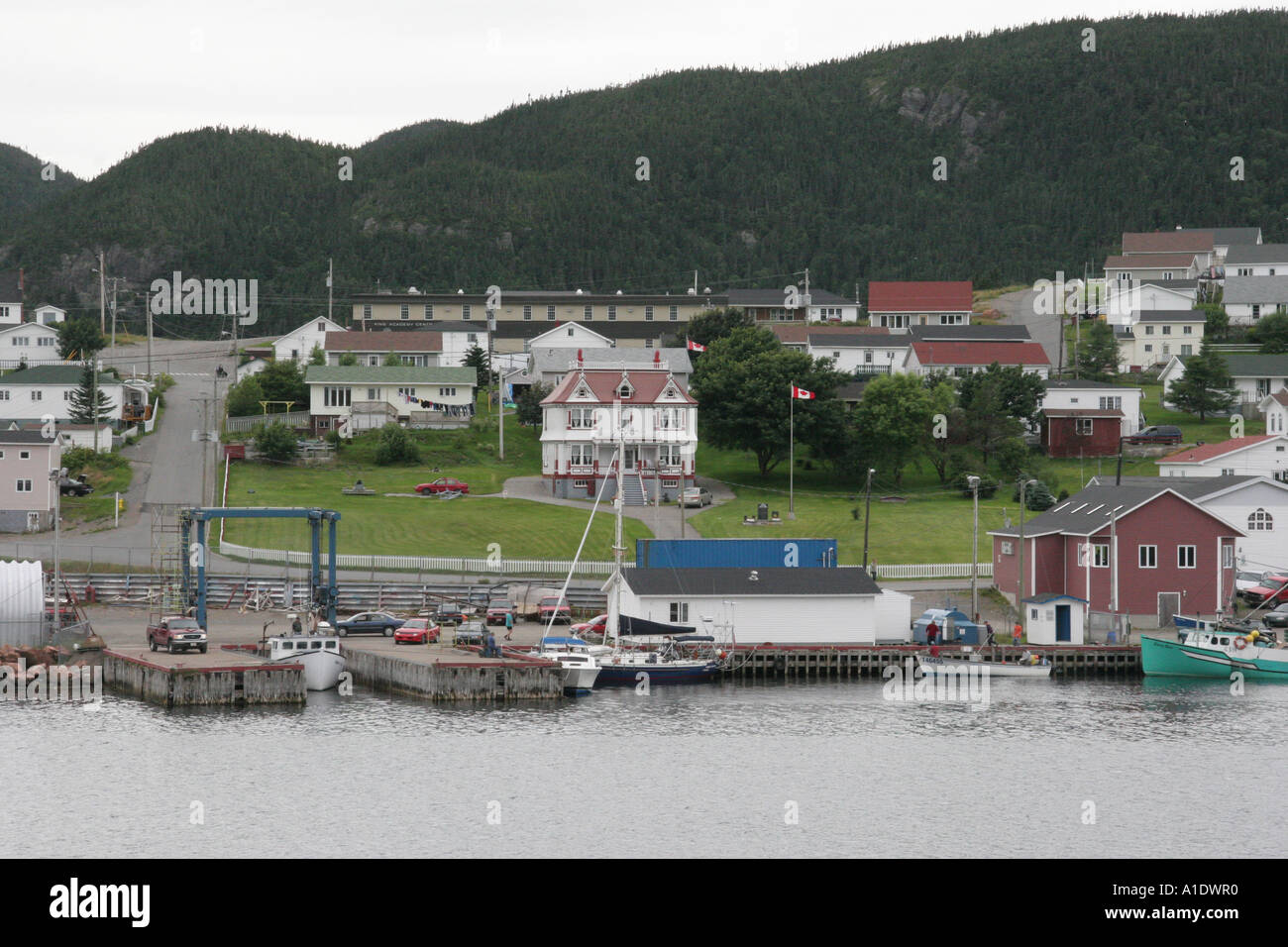 Marine Service Center at Harbour Breton Newfoundland. Sunny Cottage behind the boatyard Stock Photo