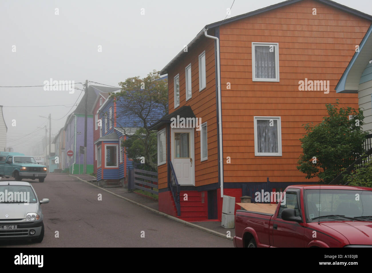 Colorful Saint Pierre Homes in Fog Stock Photo Alamy