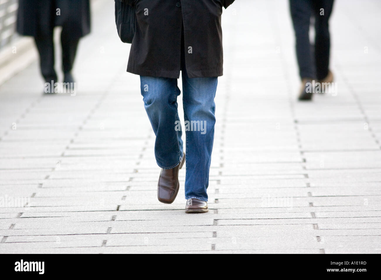 Commuters walking on pavement in London England United Kingdom Stock Photo