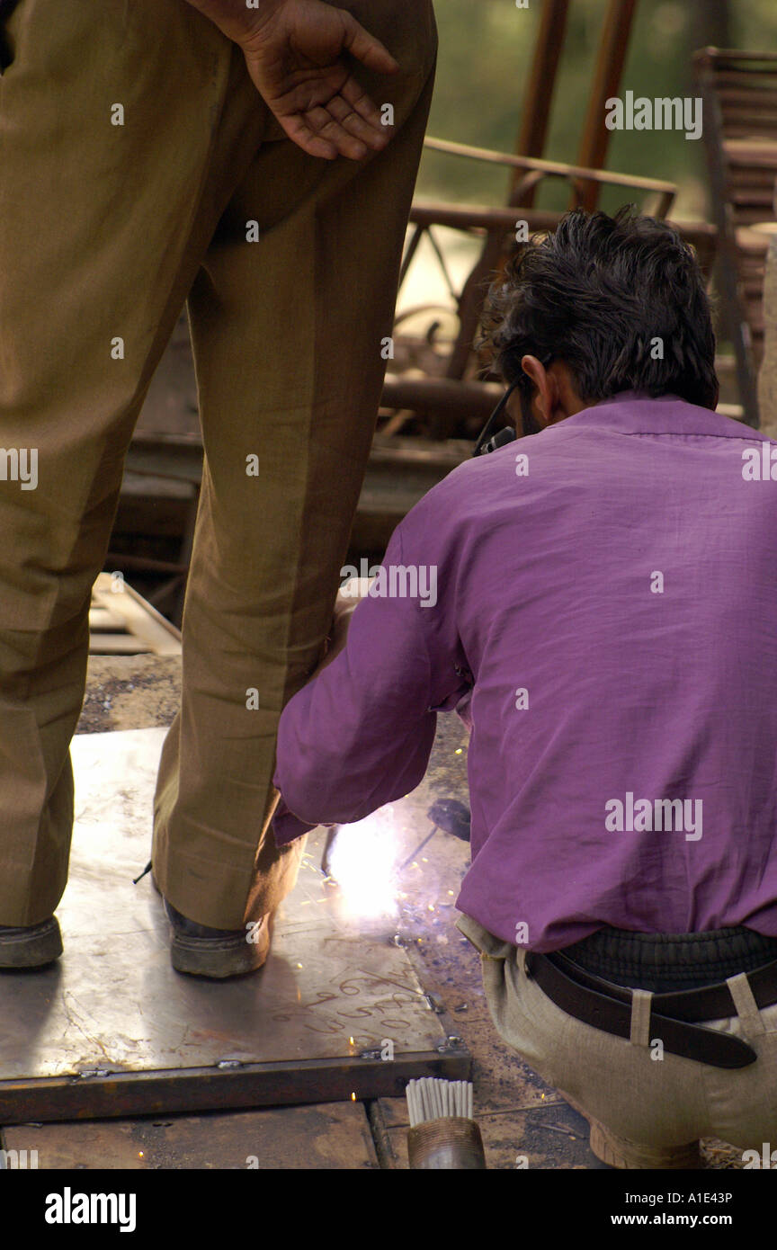 Two men man indian welding outdoors electric welder Stock Photo Alamy