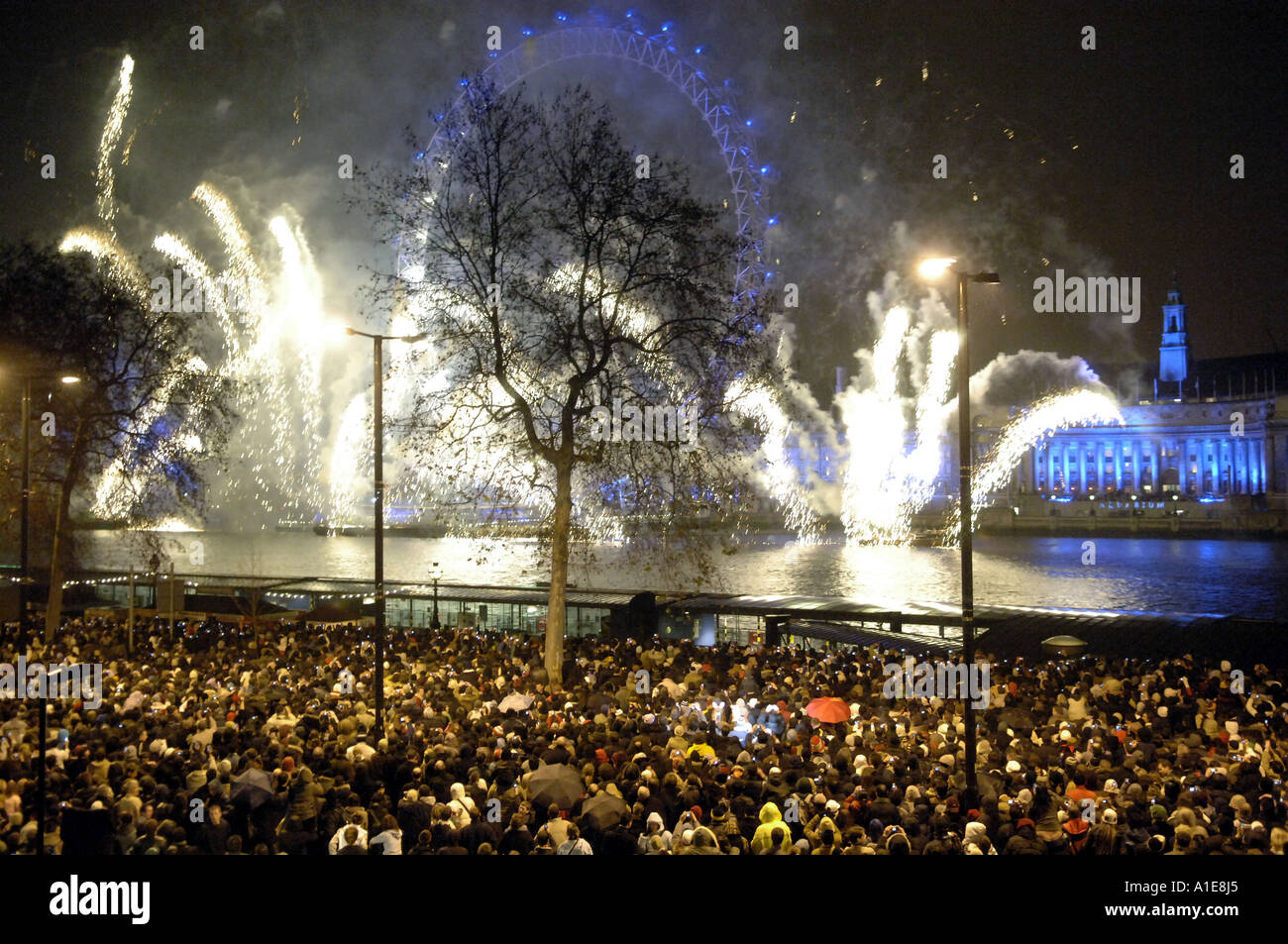 london new years eve firework display river thames westminster london eye southbank crowd colour color travel tourism lights cel Stock Photo