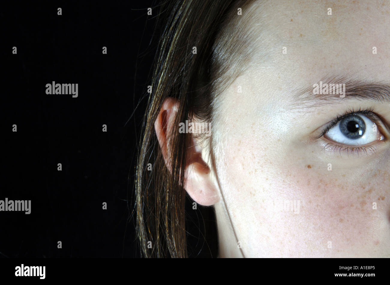 girl one eye looking up Stock Photo Alamy