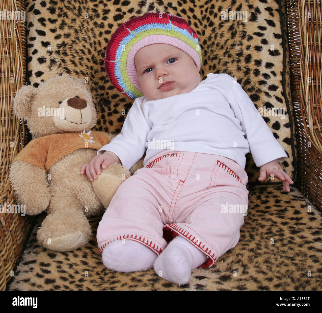 sitting child with a teddy bear Stock Photo - Alamy