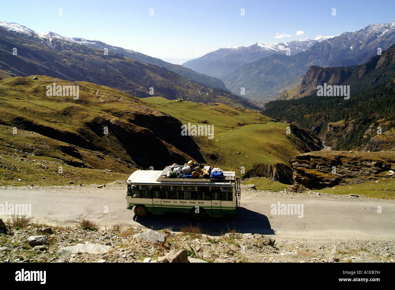 Bus at road towards Rohtang pass at the end of Kullu Valley, Indian Himalaya mountains Stock Photo