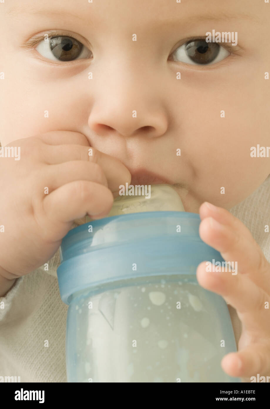 Baby drinking from baby bottle Stock Photo Alamy