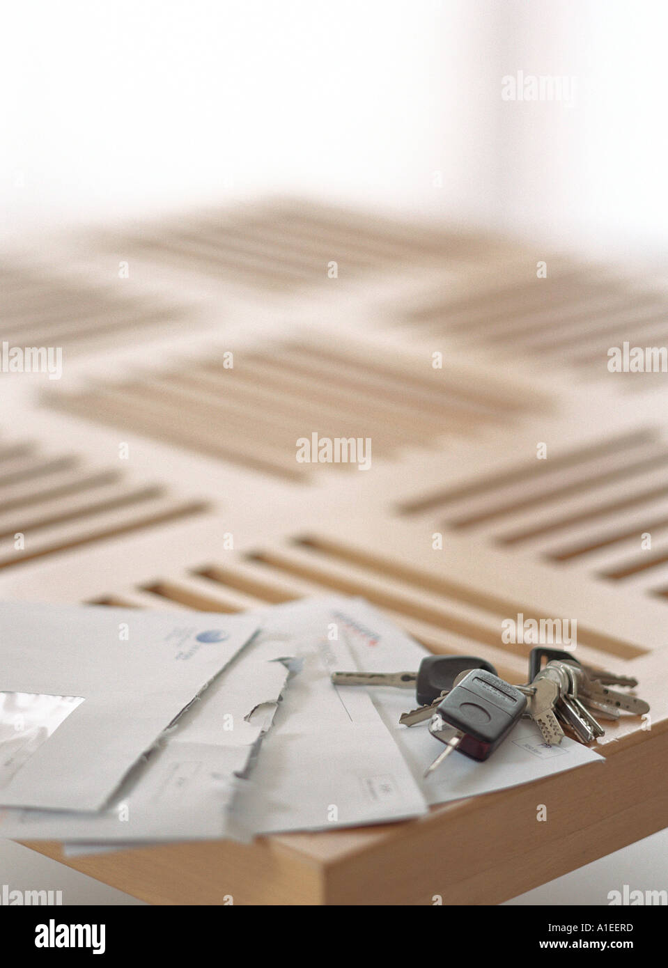 Open bills and keys on corner of table Stock Photo Alamy