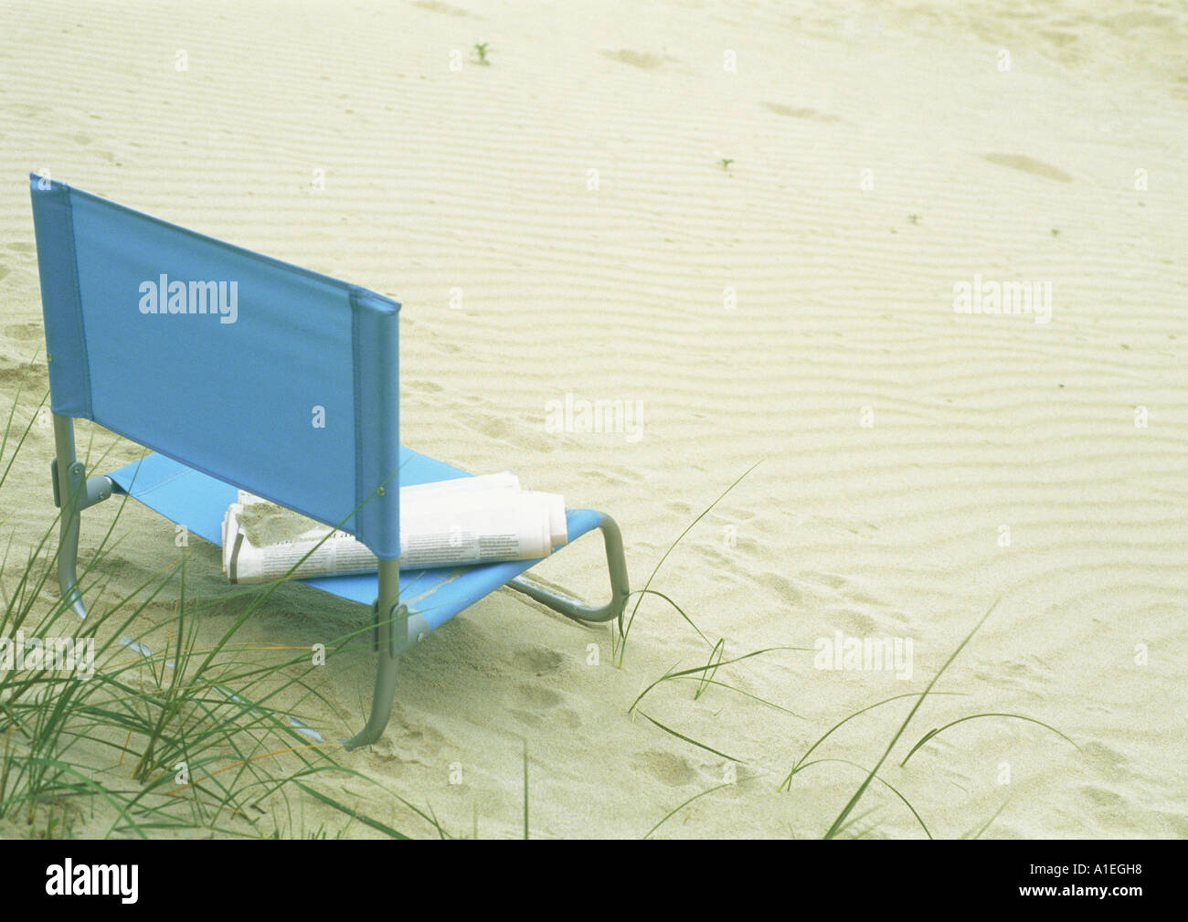 Beach chair on sand Stock Photo