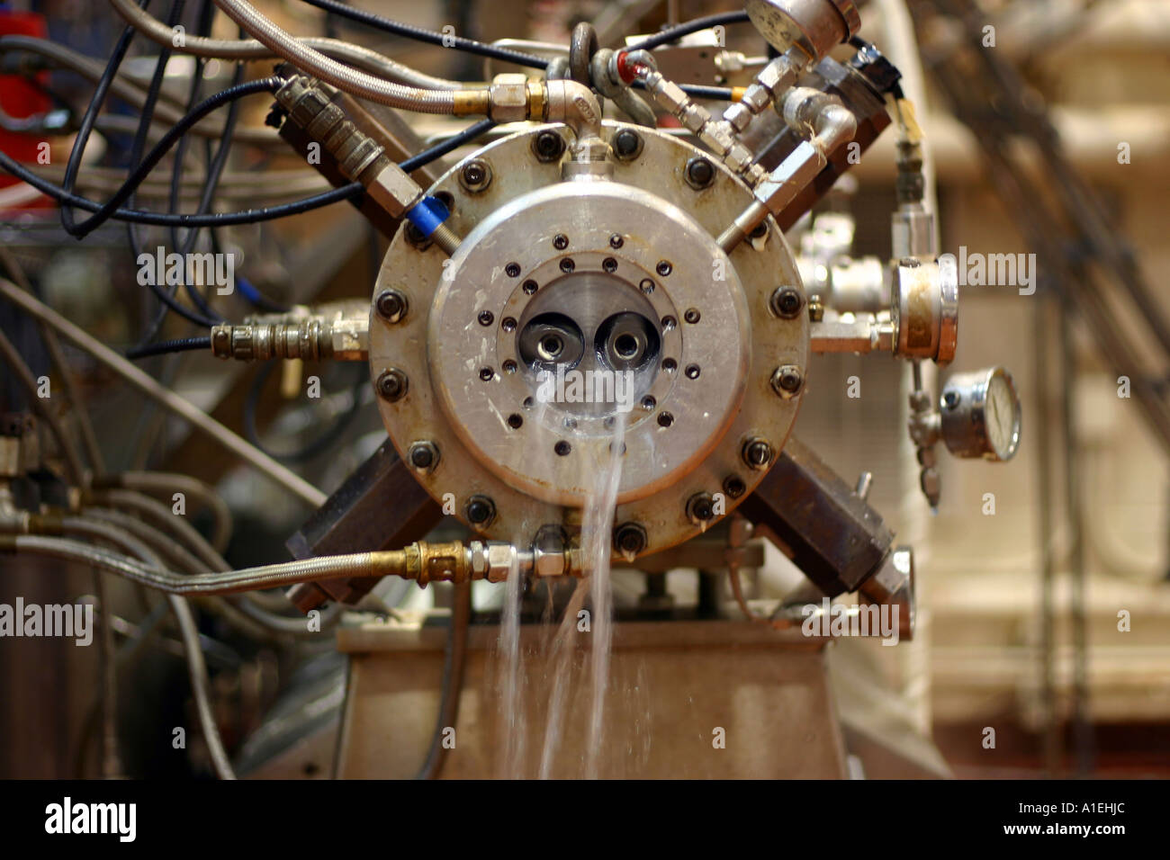 Extruder being cleaned Stock Photo - Alamy