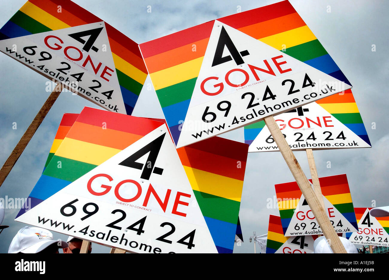 Britains first Gay estate agents, a firm based in Brighton,  show their colours on their striped 'sold' signboards Stock Photo