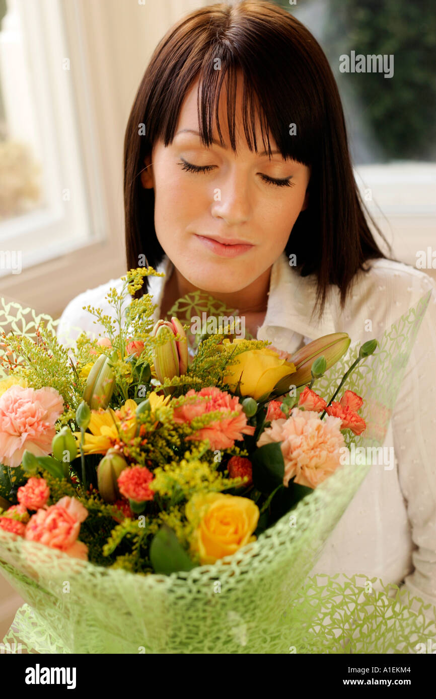 Young woman with flowers Stock Photo