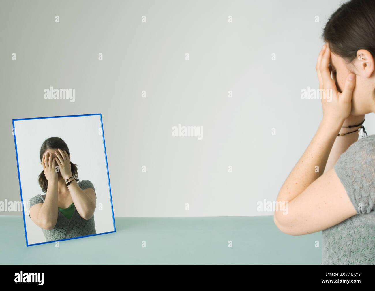 Teenage girl sad face mirror hires stock photography and images Alamy