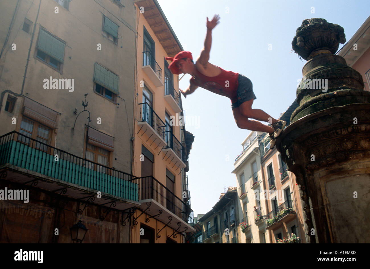 Tourist diving off the Mussel Bar statue during the Fiesta de san