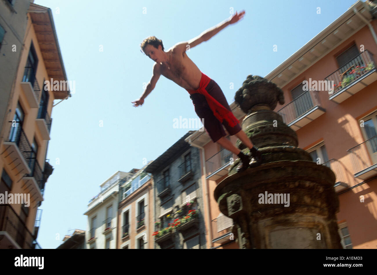 Tourist diving off the Mussel Bar statue during the Fiesta de san