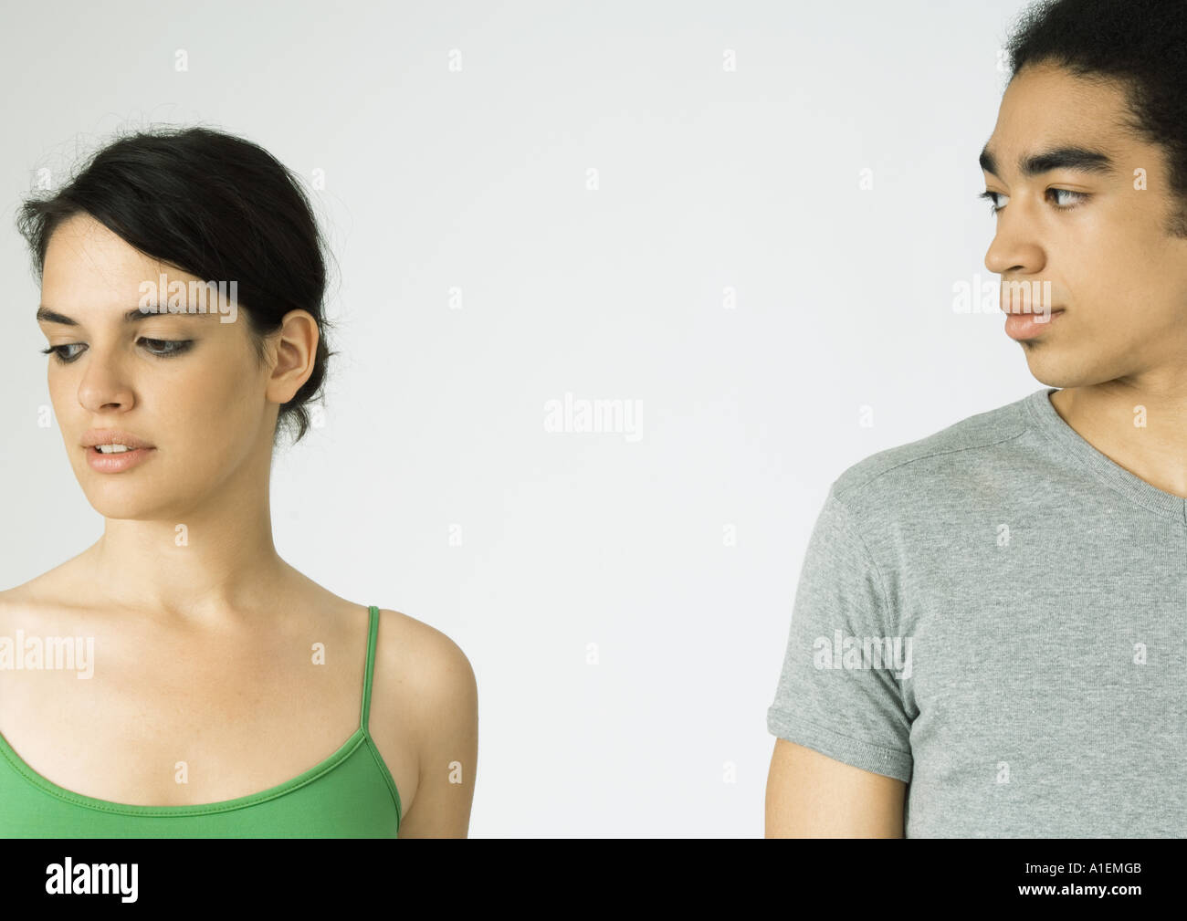 Young couple, woman looking away, man looking at woman Stock Photo