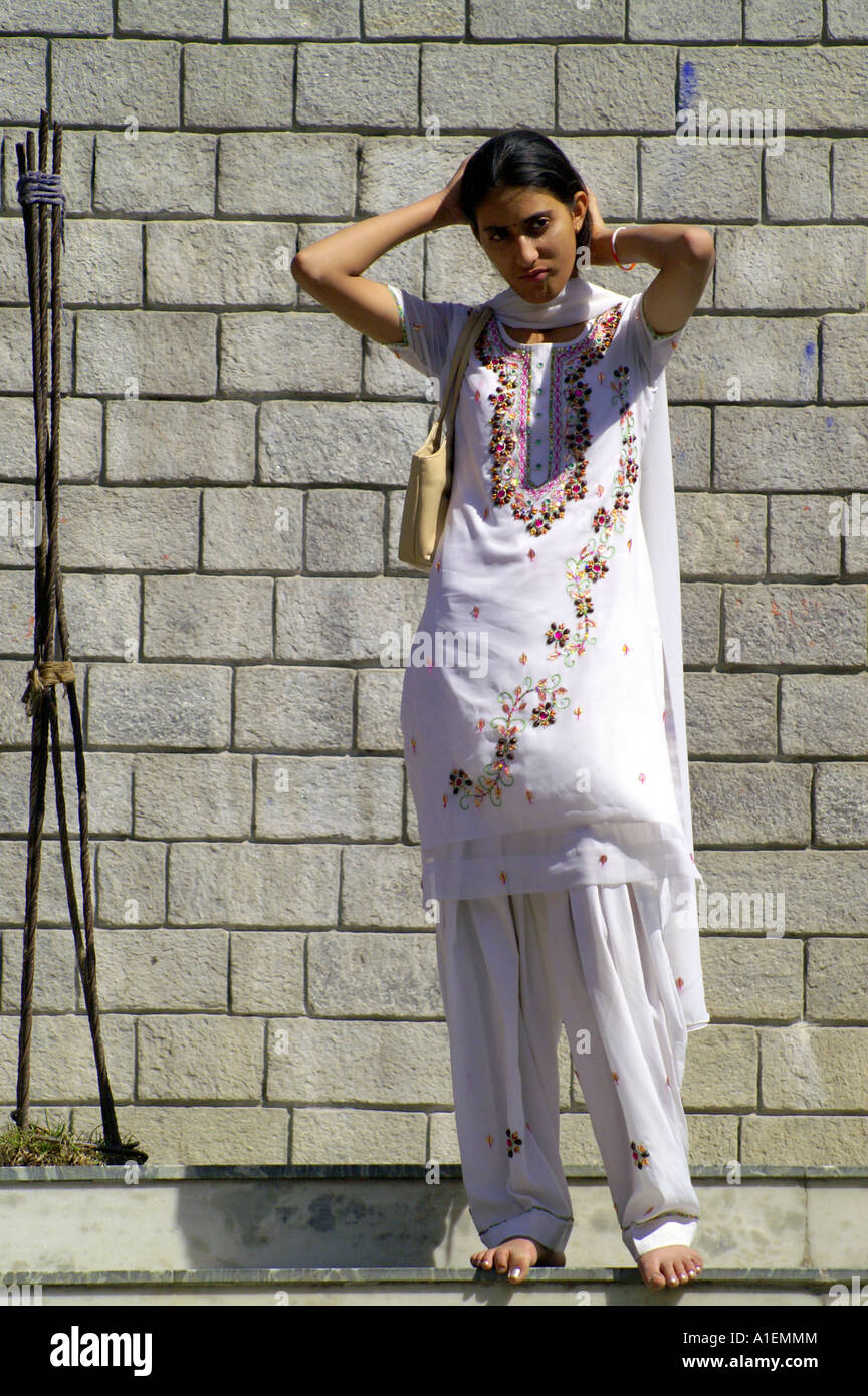 Bare Feet Indian Teenage Girl Posing In White Sari At Stairs Of Hindu