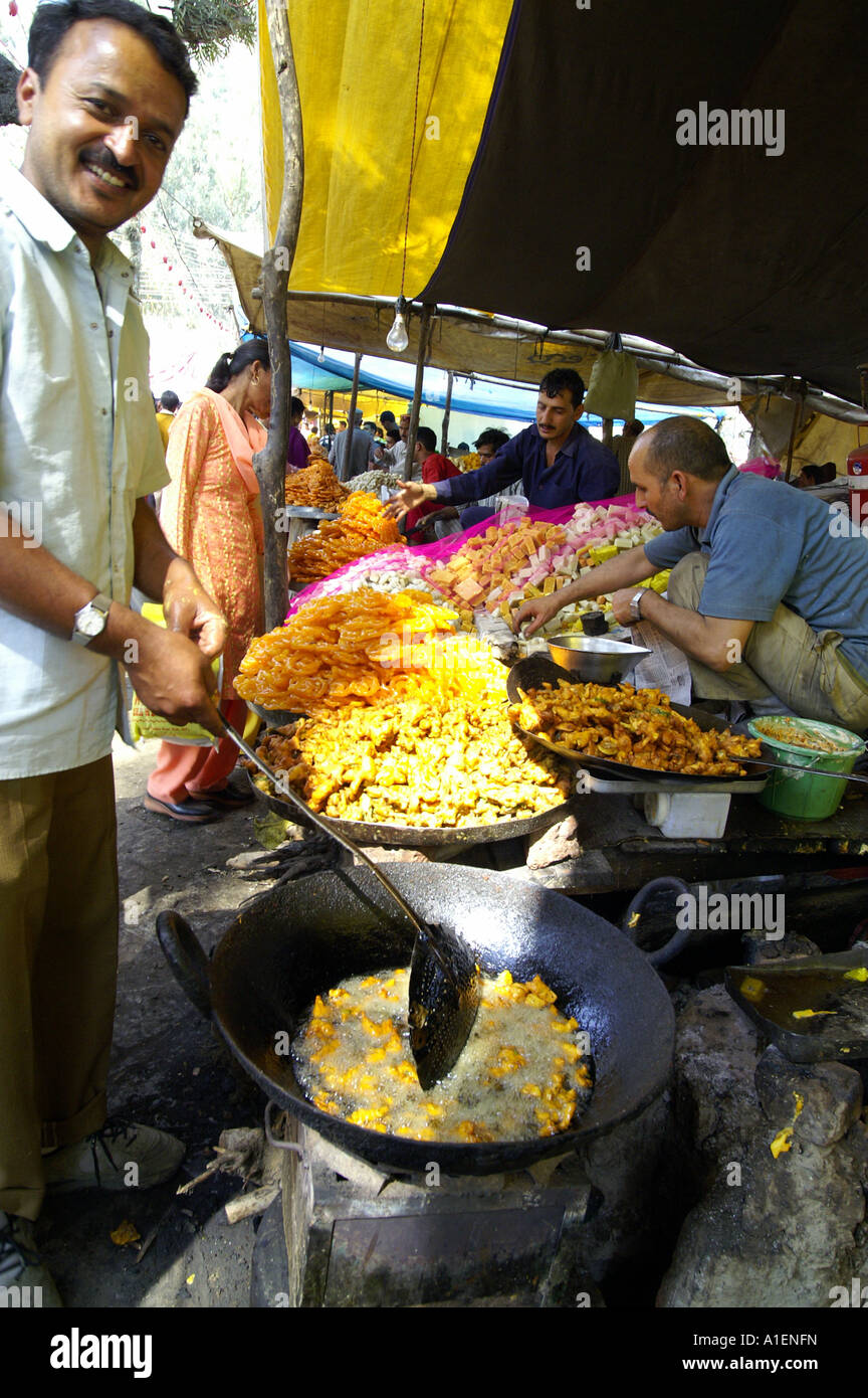 Man frying samoza at Dussehra fair with enormous variety of rich Indian