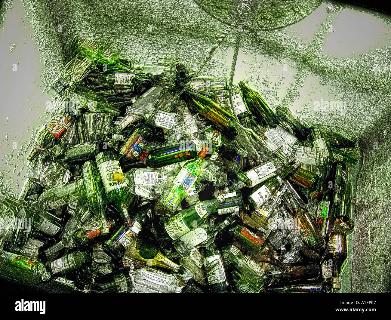 Variety of glass bottles in road side recycling container Stock Photo