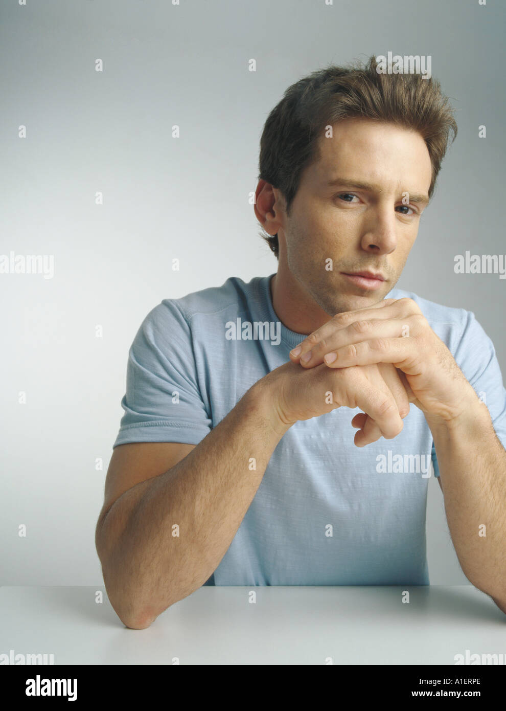 Man with hands together, portrait Stock Photo Alamy