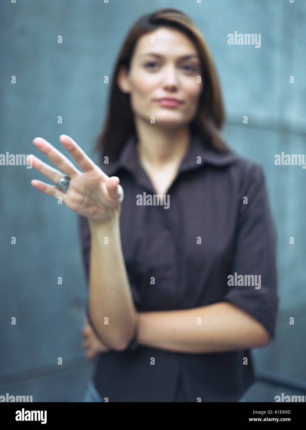 Woman gesturing, defocused Stock Photo