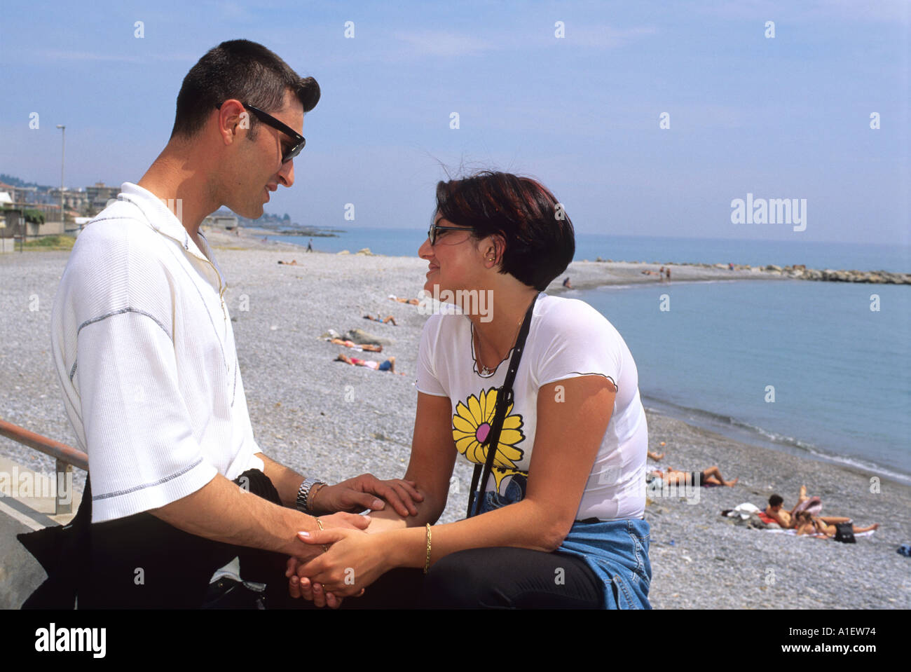 Young man woman holding hands hi-res stock photography and images - Alamy