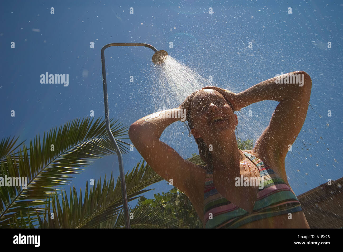 woman taking a shower outdoors Stock Photo Alamy