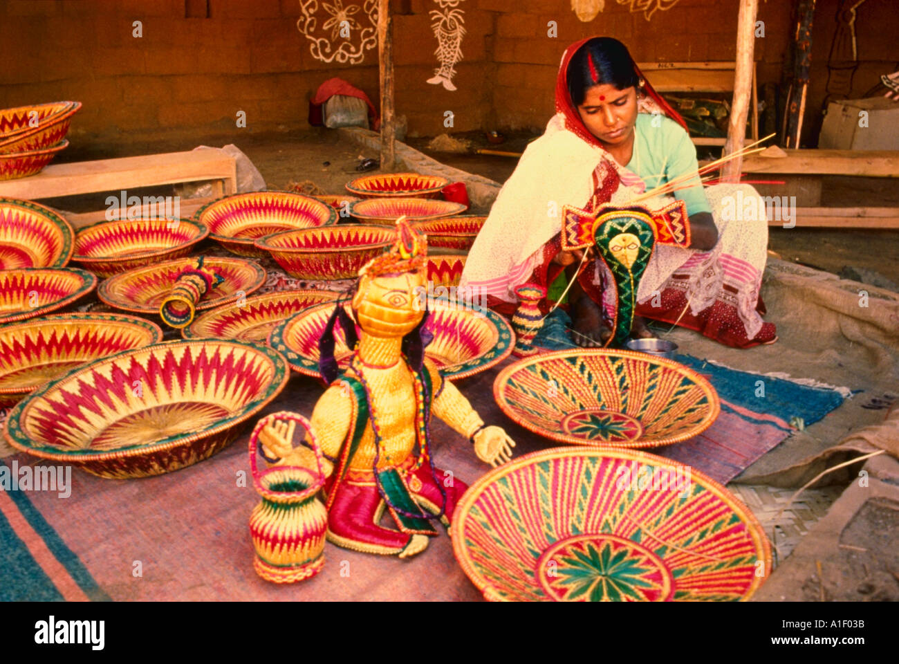 Indian woman making baskets and crafts from cane Stock Photo 127035