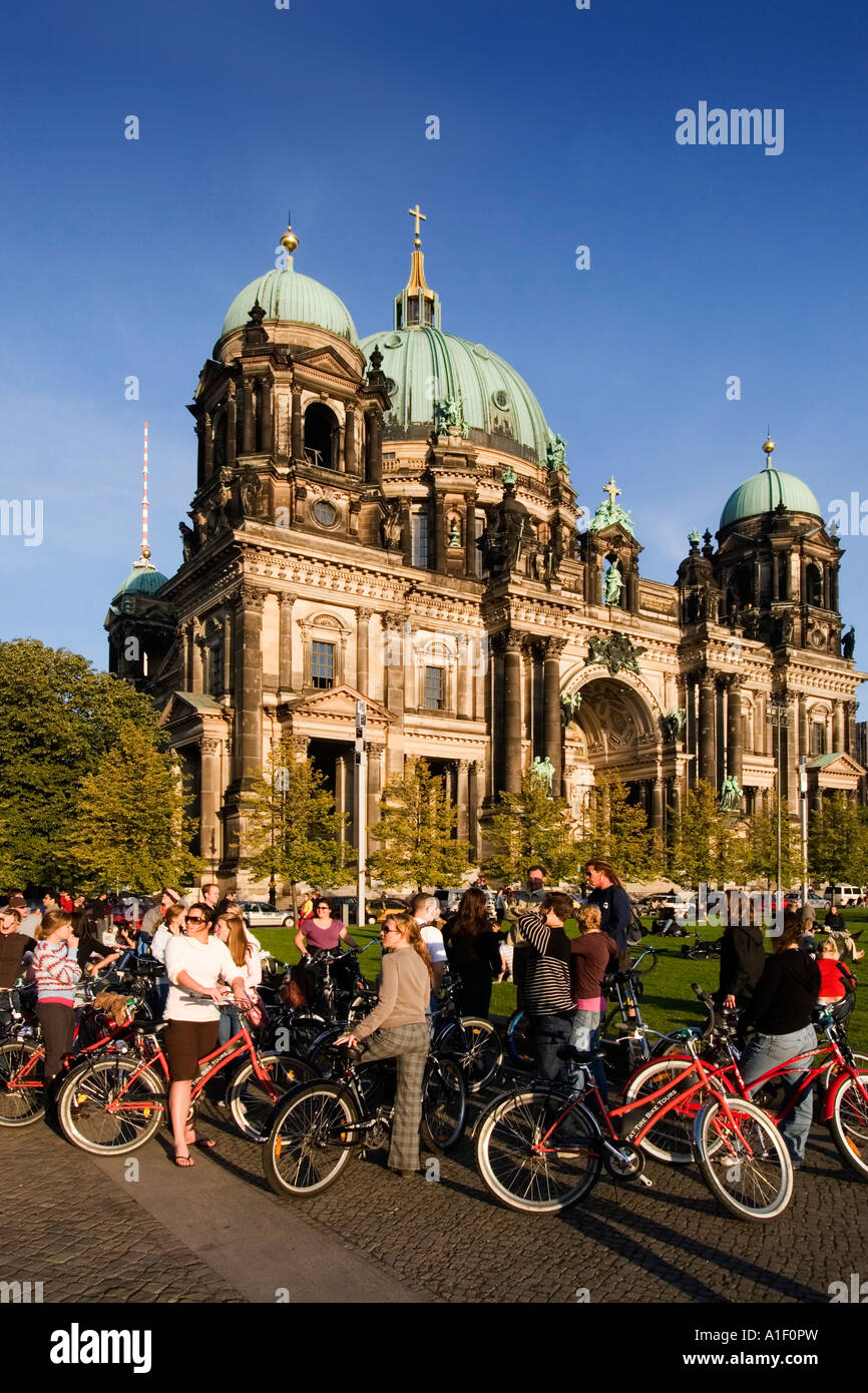 Berlin dome tour guide with tourists on bicylces Stock Photo