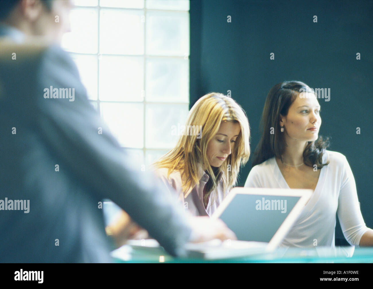 Two women and man in office Stock Photo - Alamy