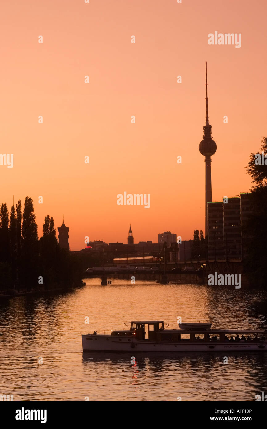 Berlin Alex TV tower sunset Friedrichshain river Spree tour boat Stock Photo
