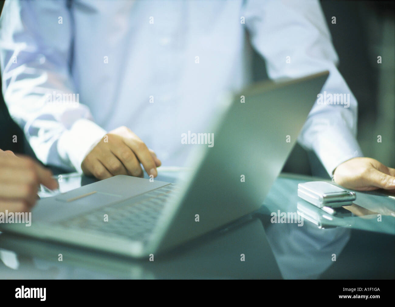 Two men using laptop Stock Photo
