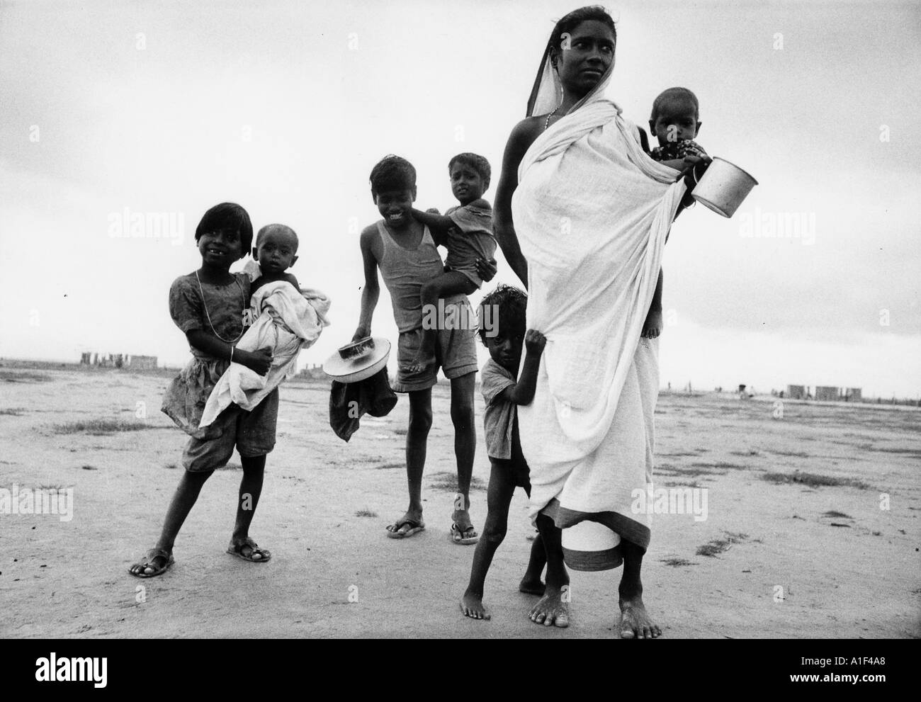Bengali woman and her children having fled from the fighting in Bangladesh arrive at Salt lake Camp Calcutta Nov 1971 Stock Photo