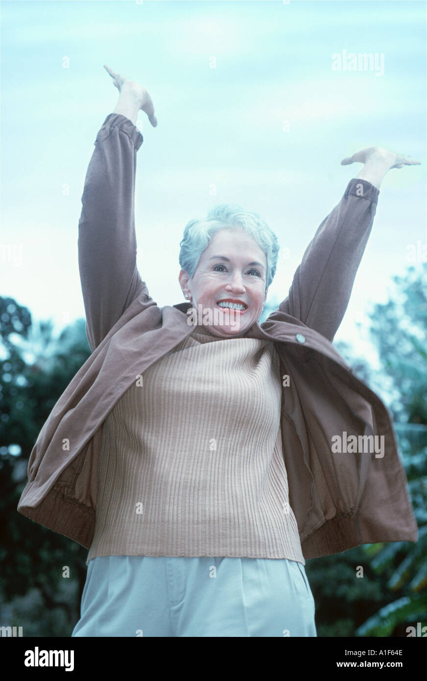 Exuberant mature woman outdoors Stock Photo