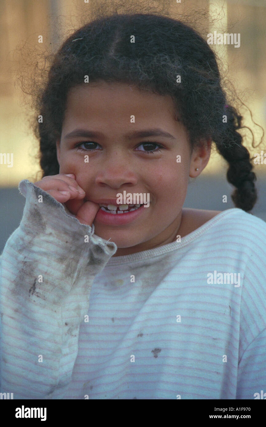 Little Girl With Messy Hair And Dirty Shirt Has Just Had A Good