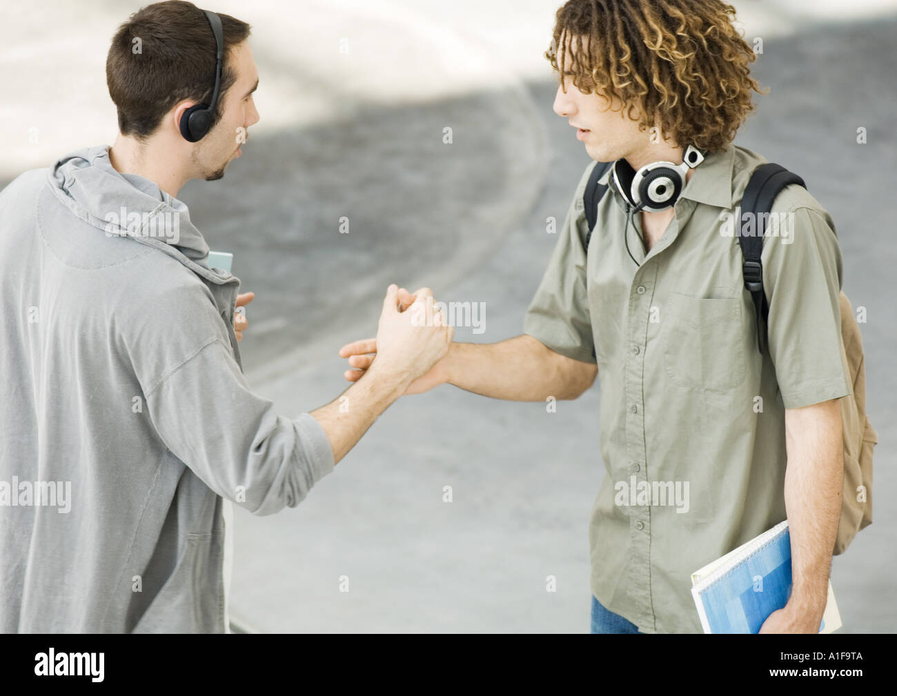 Teenagers shaking hands hires stock photography and images Alamy