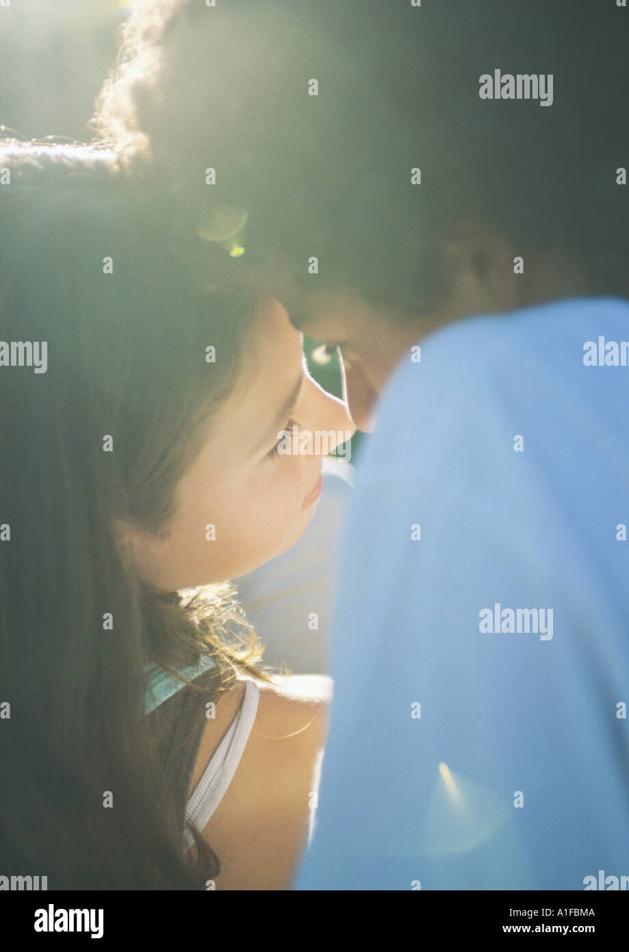 Teenage couple about to kiss Stock Photo