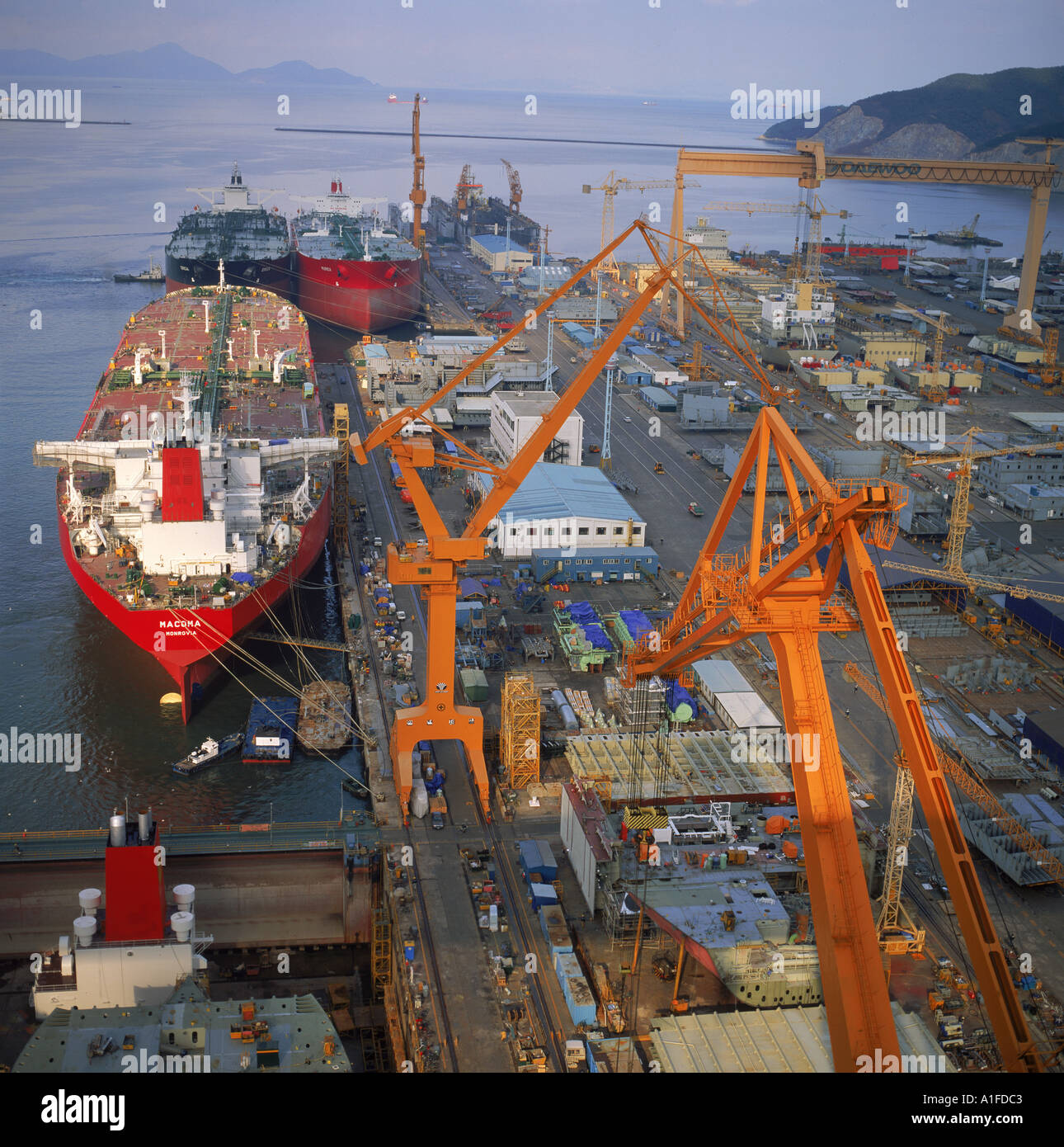 Cranes and ships in the Okpo Shipyard in South Korea Asia D Lomax Stock