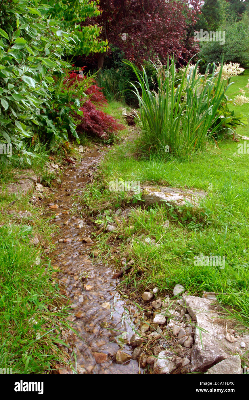 Small UK garden stream water feature Stock Photo Alamy
