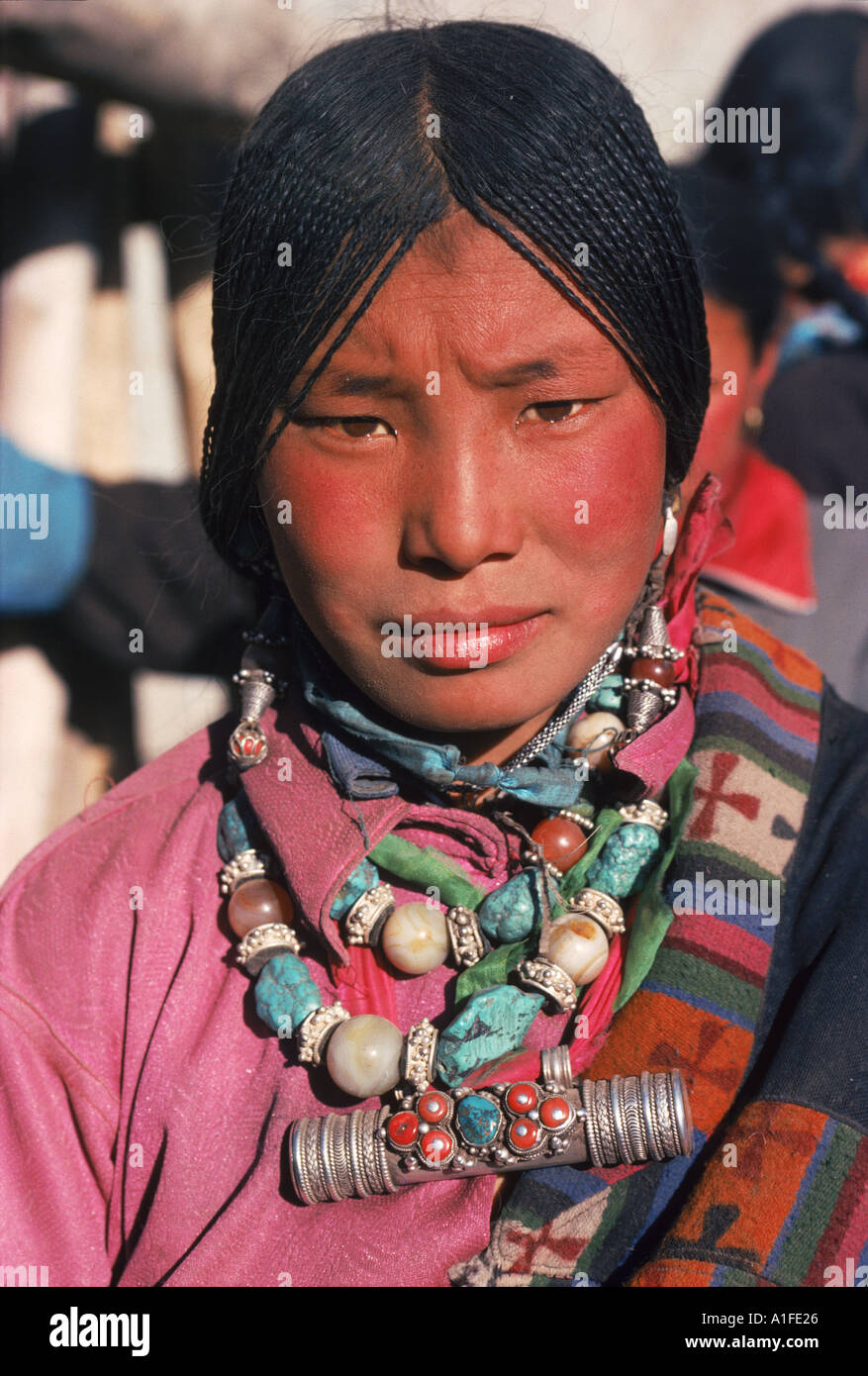 Portrait of a Tibetan nomad woman with turquoise and silver jewellery at Tongren Qinghai China G Corrigan Stock Photo
