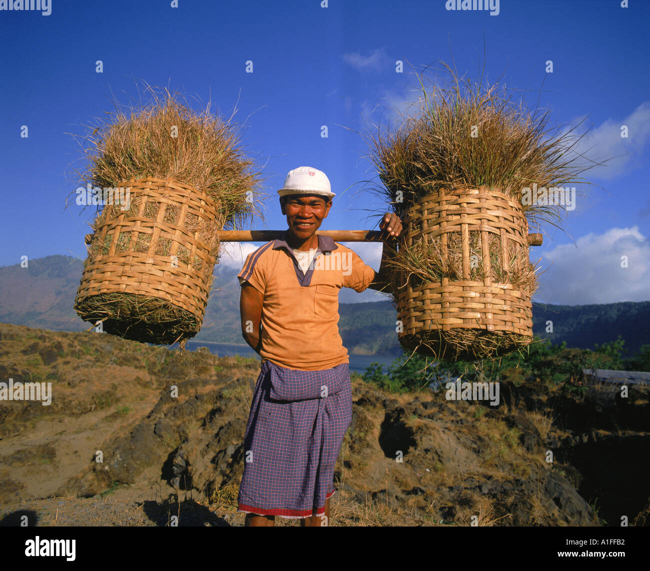 Man carrying two baskets on hi-res stock photography and images - Alamy