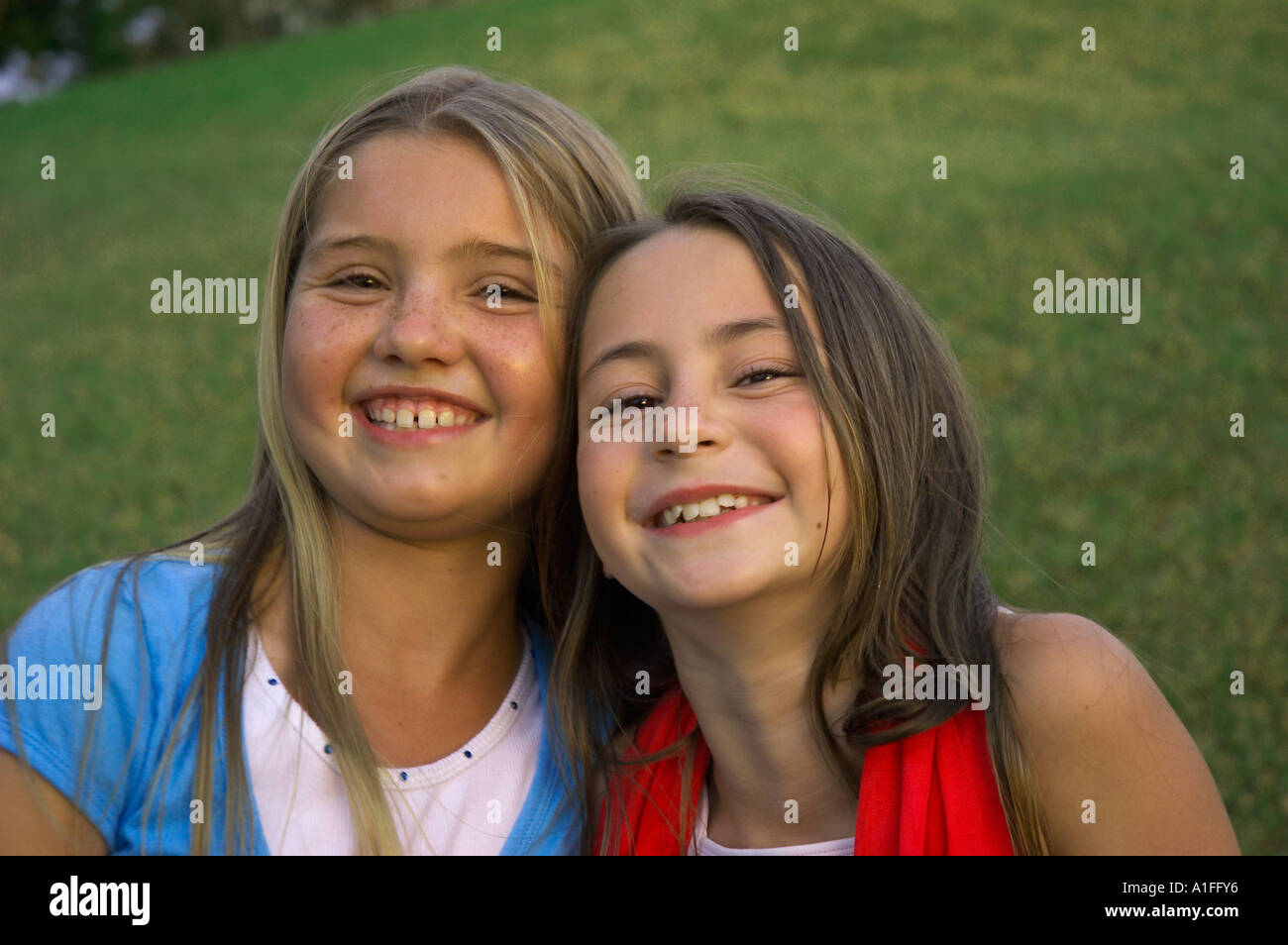 Positive two girls laughing hi-res stock photography and images - Alamy