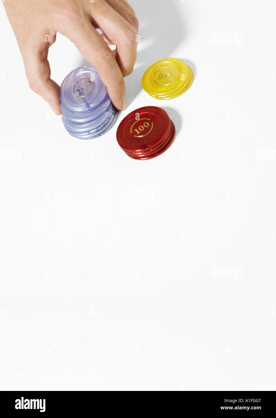 Hand stacking poker chips Stock Photo Alamy