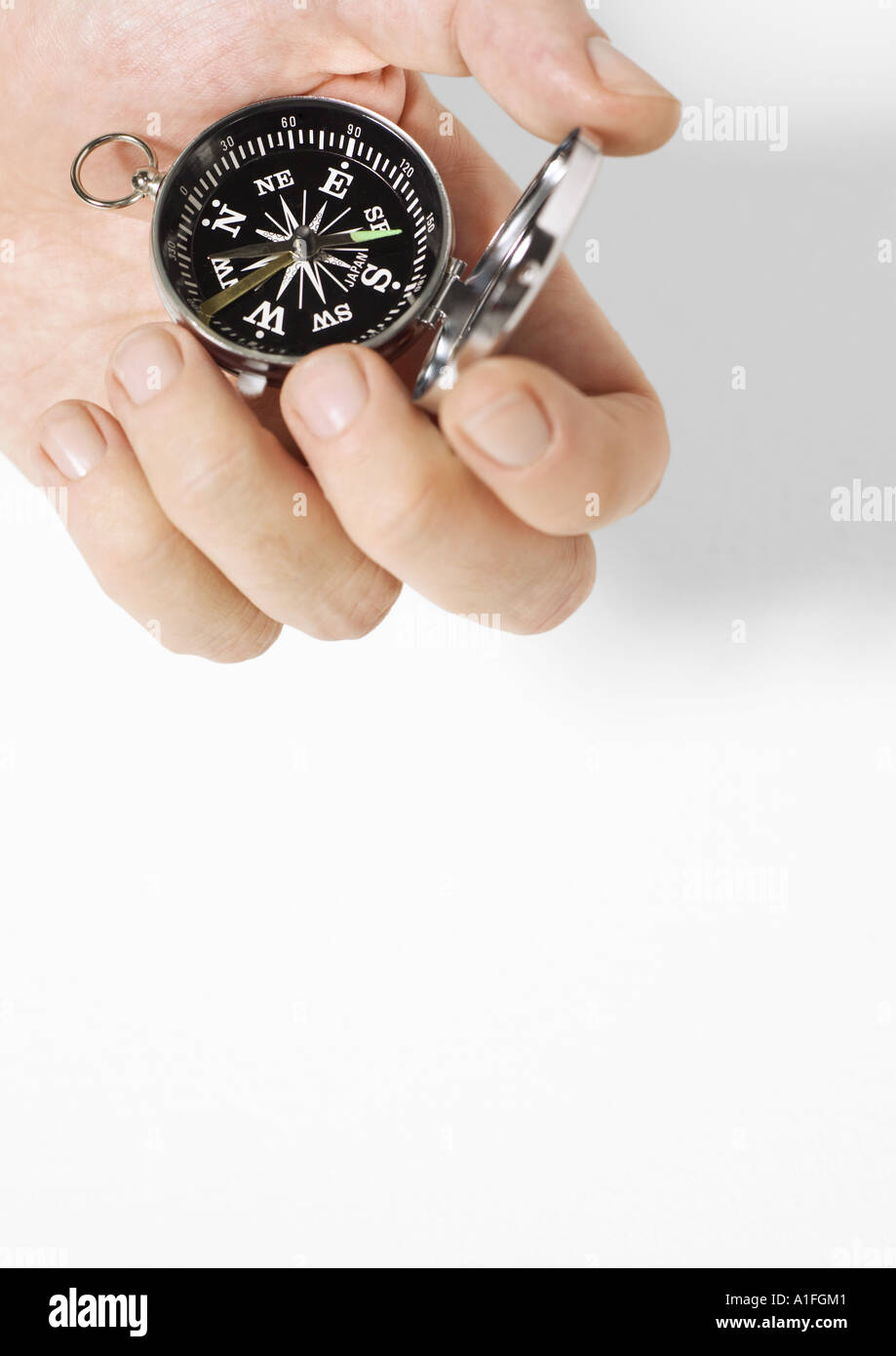 Hand holding compass Stock Photo Alamy